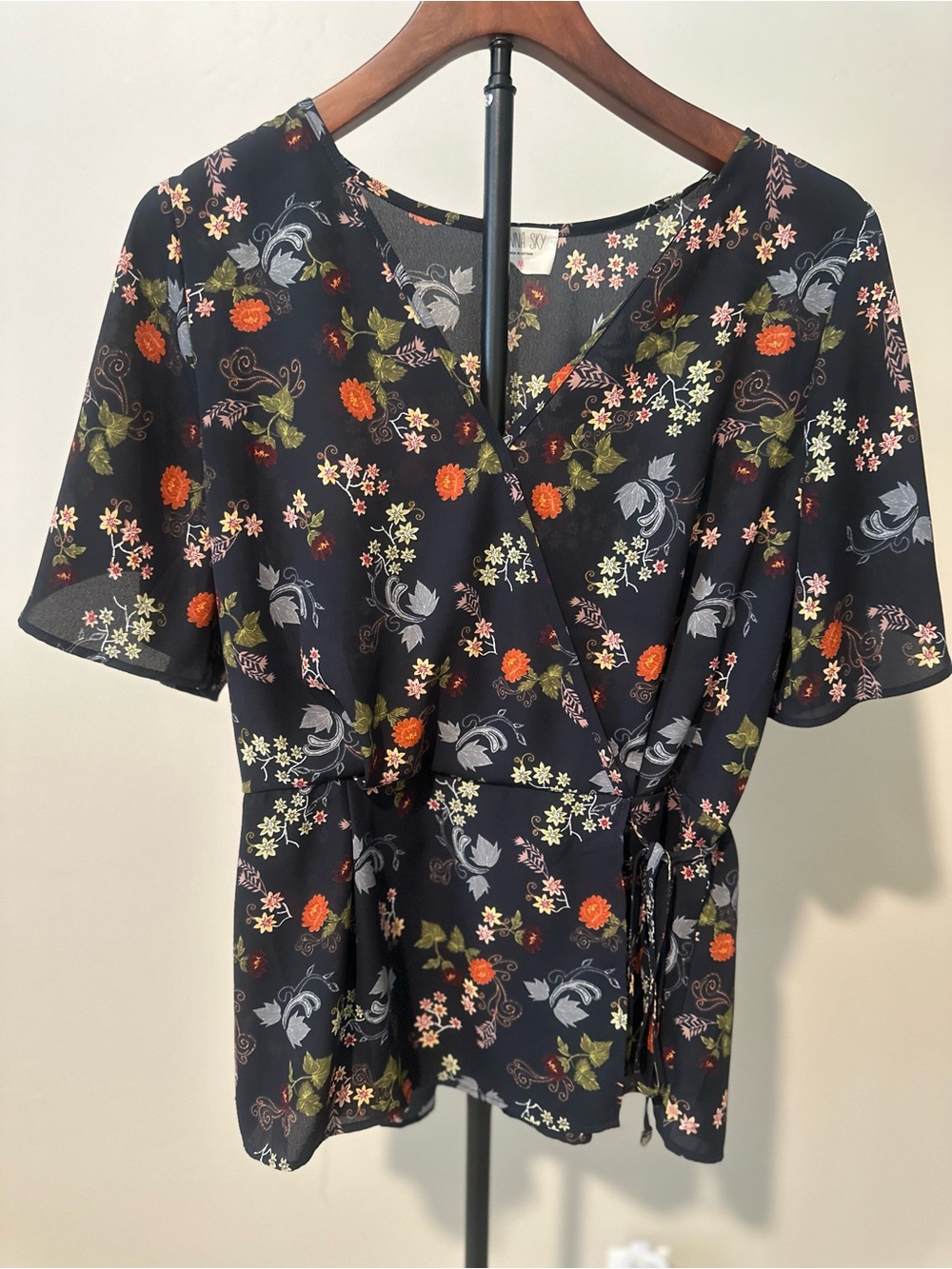 Sienna Sky Black Floral Wrap Blouse with Orange and Cream Accents